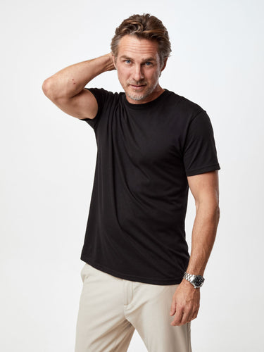 Ariel is 6'1, 175lbs and wears a size M # Men's Black Crew Neck | Fresh Clean Threads
